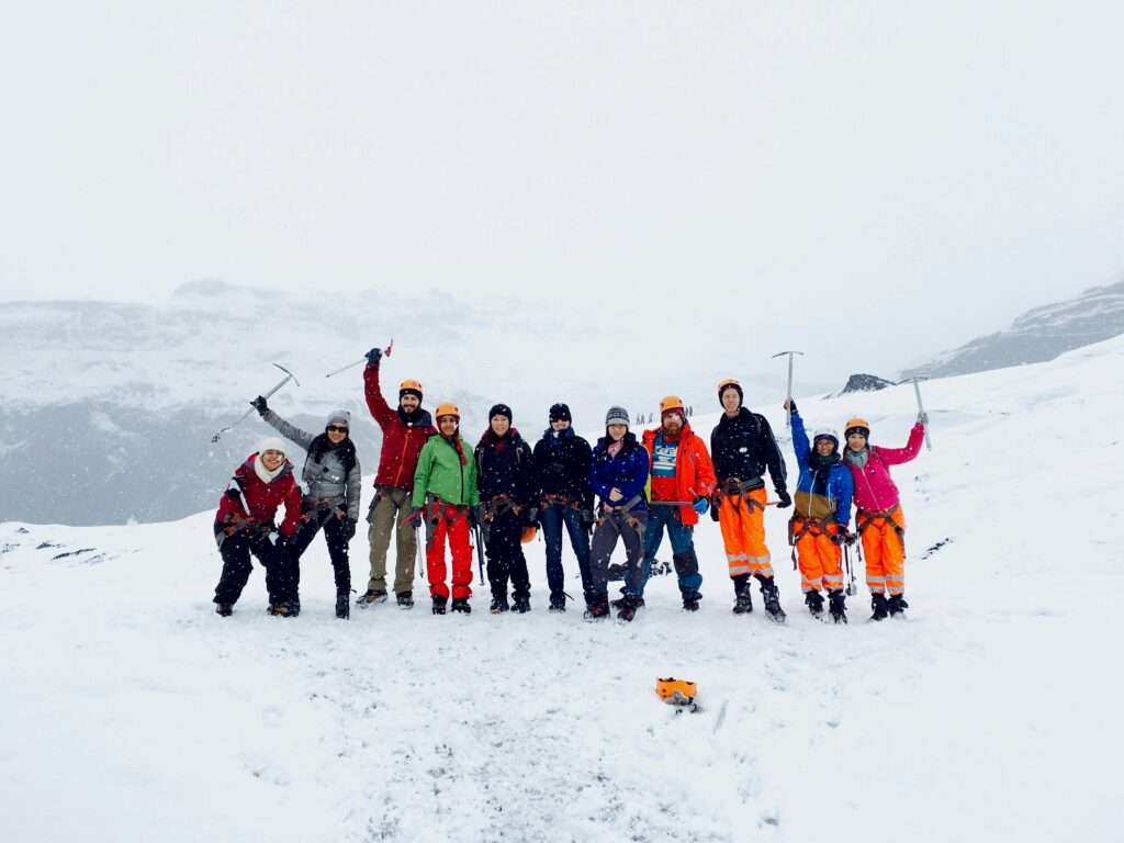 mountaineering course: group of people top on mountain